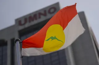A United Malays National Organisation (UMNO) flag waves outside the party headquarters in Kuala Lumpur, Malaysia. Photo: EPA-EFE