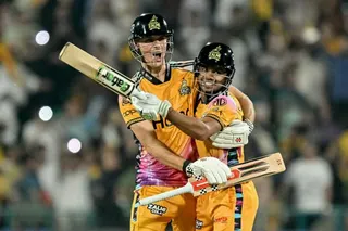Peshawar Zalmi's Australian cricket player Aaron Hardie (L) and teammate Pakistani cricket player Farhan Yousaf celebrate their team's win at the end of the Pakistan Super League (PSL) Twenty20 final match between Hyderabad Kingsmen and Peshawar Zalmi at the Gaddafi Stadium in Lahore on May 3, 2026. (Photo by Arif ALI / AFP)