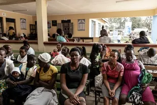 Mothers with children waiting at Kuoyo Sub-county hospital in Kisumu, Kenya.