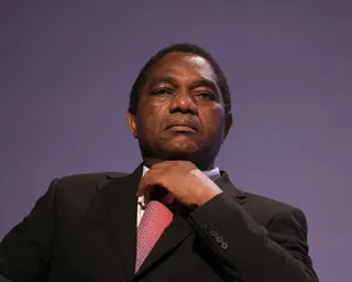 A middle-aged African man in a dark suit