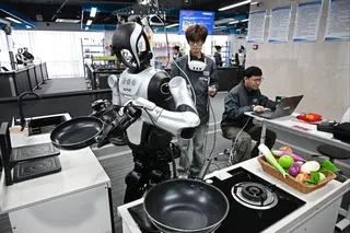 Employees put a robot through its paces at the Qingdao Humanoid Robot Data Training Centre in Qingdao, Shandong province, on March 23. Photo: Xinhua
