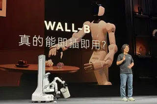 X Square Robot CEO Wang Qian demonstrates a robot that can pick up rubbish during the unveiling of the Chinese firm’s new Wall-B model in Beijing on April 21, 2026. Photo: Reuters