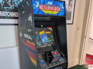 Image may contain Arcade Game Machine Game and Person