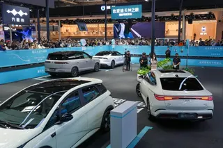 People watch a demonstration of BYD’s self-parking technology during the 2026 Beijing International Automotive Exhibition on April 26, 2026. Photo: Xinhua