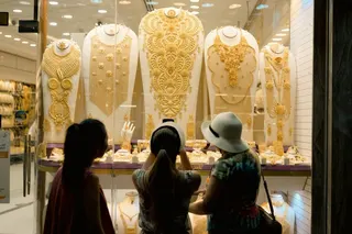 Tourists admire gold jewellery at the Gold Souq in Dubai. Photo: Shutterstock
