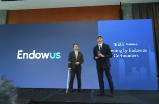 Endowus Co-Founders speak on stage at the Endowus Investment Summit in Hong Kong.