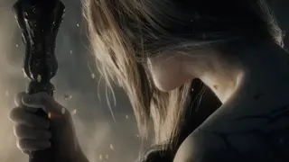 Elden Ring trailer image showing the face of a character obscured by their long hair.