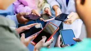 Getty Images Students on their mobile phones