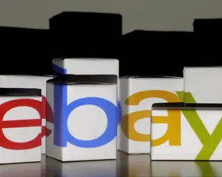 The eBay logo is projected on to white boxes