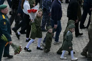 TOPSHOT - Children wearing Soviet-era uniforms attend a ceremony marking the 81st anniversary of the victory over Nazi Germany in World War II at the Savur-Mohyla memorial in the Donetsk region, Russian-controlled Ukraine on May 8, 2026, amid the ongoing Russian-Ukrainian conflict.