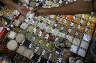 Pulses with price tags on display at a grocery store in Mumbai, India.