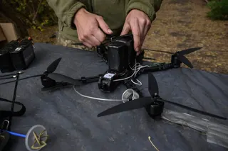 A Ukrainian soldier of the Black Wing unit, 116th Mechanized Brigade, tests an FPV drone at a workshop facility in an undisclosed location near the front line of eastern Ukraine, Kharkiv region, on October 8, 2025, amid the Russian invasion of Ukraine. — AFP pic