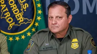 Michael Banks in uniform with his Customs and Border Patrol badge