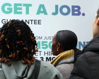 Young people looking at signage at the event
