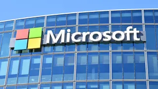This photograph shows the logo of Microsoft displayed on the facade of the company France headquarters in Issy-les-Moulineaux, on the outskirts of Paris, on April 24, 2026. (Photo by Martin LELIEVRE / AFP via Getty Images)