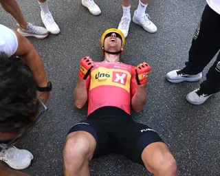 Fredrik Dversnes recovers on the ground after winning stage 15 of the Giro d’Italia