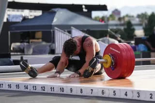 Boady Santavy, of Canada, sits on the floor after an unsuccessful lift during the weightlifting event but the Enhanced Games gave him an extra go.
