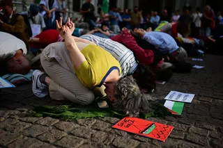 People take part in a flash mob entitled ‘In the same boat’ to protest against the detention and treatment by Israel of activists participating in the Global Sumud Flotilla,
in Milan, northern Italy, on Thursday, following activists’ detention in Israel after attempting to break the sea blockade on Gaza. Photo: AFP
