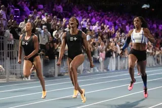 Tristan Evelyn, of Barbados, centre, celebrates as she wins the women’s 100m final while racing clean in Las Vegas.
