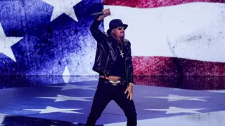 Musician Kid Rock performing onstage at the Fiserv Forum in Milwaukee
