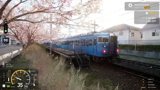 A blue train under cherry blossom.