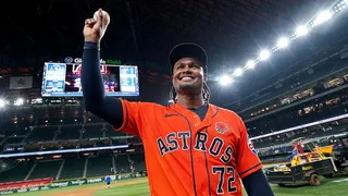 Houston Astros pitcher Alimber Santa holding up baseball after no-hitter