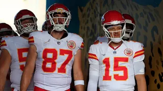 Patrick Mahomes and Travis Kelce standing on the sidelines at EverBank Stadium