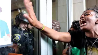 UCLA police officers securing Dodd Hall on campus