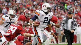 Quarterback Cam Newton running with football at Bryant-Denny Stadium