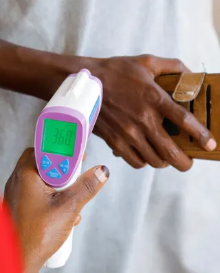 A medical officer checks the temperature of a man to screen against the spread of the Ebola virus in Kampala, Uganda, May 26, 2026. — Reuters pic