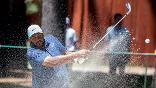 Jerome Bettis swinging a golf club at Edgewood Tahoe Golf Course