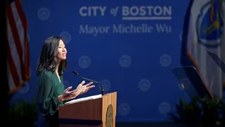 Mayor Michelle Wu speaking at a podium delivering State of the City Address