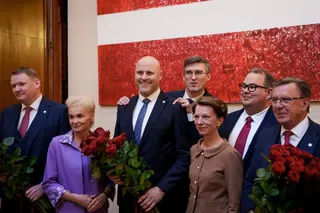 Andris Kulbergs (3rd L), Latvia's new Prime Minister, poses for a photo with party colleagues from United List (Apvienotais Saraksts) on the sidelines of a parliamentary session after the vote for the approval of the new cabinet of government ministers in the Saeima (Parliament of Latvia) on May 28, 2026 in Riga, Latvia.