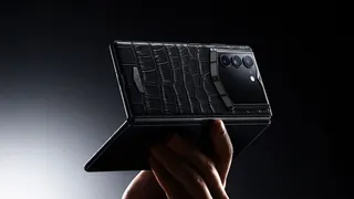 Image may contain Electronics Mobile Phone Phone Accessories Baby and Person