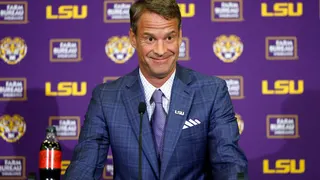 Lane Kiffin speaking at a press conference at Tiger Stadium in Baton Rouge, Louisiana
