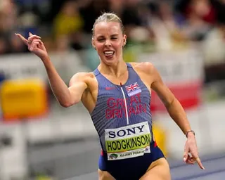 Keely Hodgkinson gestures as she crosses the finish line to win 800m gold in at the World Athletics Indoor Championships in Torun, Poland