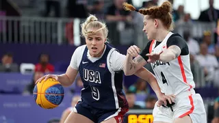 Hailey van Lith driving past opponents during a 3x3 basketball game in Paris