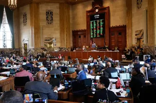 Louisiana lawmakers look up to angry shouts from members of the public after a redistricting plan to eliminate a majority-Black congressional district,