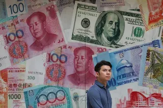 A man walks past a money exchange shop in Central, Hong Kong. Photo: Felix Wong