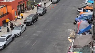 Homeless encampments line a street near the Skid Row Care Campus in downtown Los Angeles