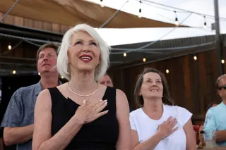 FILE PHOTO: Republican Secretary of State candidate for Colorado, Tina Peters, a county clerk and election denier who's been indicted on criminal charges for tampering with voting machines, sings the National Anthem at her primary election night rally in Sedalia, Colorado, U.S., June 28, 2022. REUTERS/Kevin Mohatt/File Photo