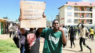 Demonstrators participate during a protest against a U.S.-backed Ebola quarantine plan on the establishment of a 50-bed facility at a Kenyan air force base that was intended to host Americans exposed to Ebola, in Nanyuki town, in Laikipia County, Kenya June 1, 2026. REUTERS/John Muchucha