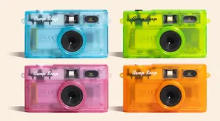 Four versions of the Camp Snap 2 camera featuring transparent shells.