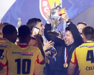 Pierre Sage and his Lens players celebrate winning the French Cup