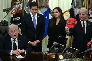 US Ambassador to Lebanon Michel Issa (R) holds a signed "Make America Great Again" hat while (L-R) US Secretary of State Marco Rubio and Lebanon Ambassador to the US Nada Hamadeh Moawad listen to US President Donald Trump speak during a meeting with Lebanon Ambassador to the US and Israel Ambassador to the US, at the White House in Washington, DC on April 23, 2026.