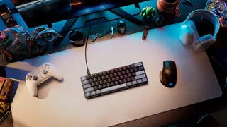 Corsair's gaming keyboard, gaming headset, and gaming mouse on a white mousepad