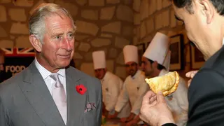 King Charles III being shown a pasty in Real del Monte in the Pasty Museum