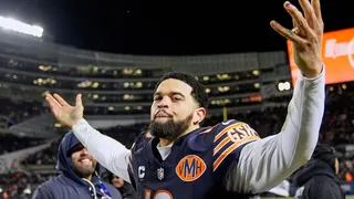 Chicago Bears' Caleb Williams celebrating on the field after a playoff game