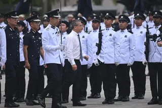 Law Minister Edwin Tong inspecting the parade at the Home Team Academy on June 3.