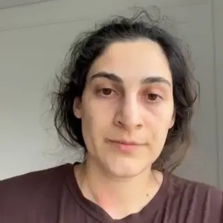 Supplied Close up of Zeynab Javadli, who has dark hair and is wearing a brown top.